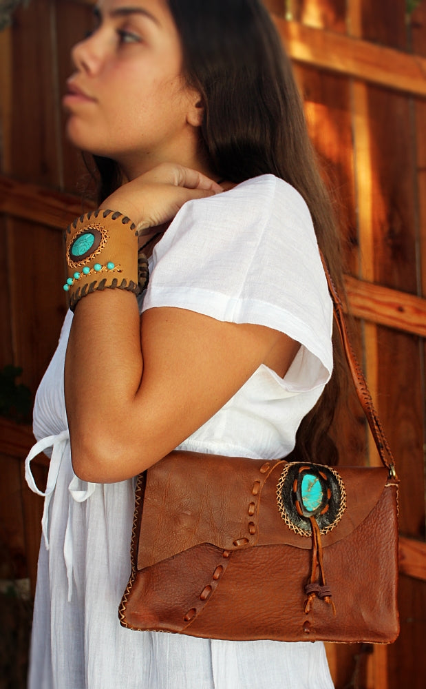 Handmade Cowhide leather adjustable clutch/purse with stone accent