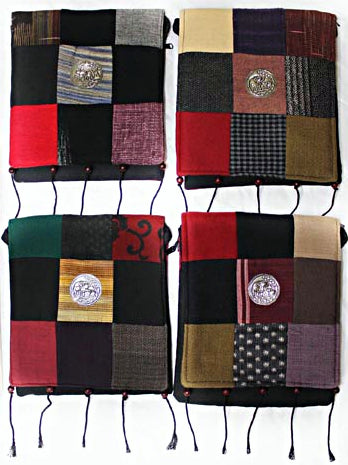 Handmade cotton textile patchwork cross body with elephant medallions accent