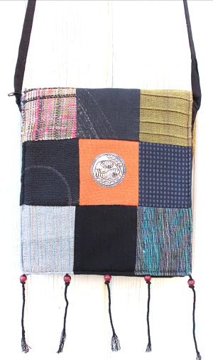Handmade cotton textile patchwork cross body with elephant medallions accent