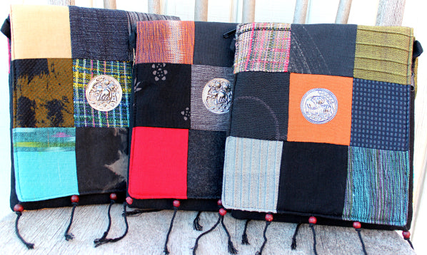 Handmade cotton textile patchwork cross body with elephant medallions accent