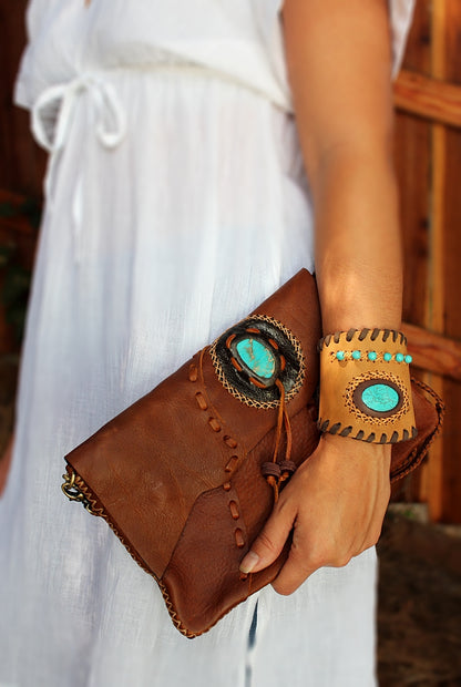 Handmade Cowhide leather adjustable clutch/purse with stone accent