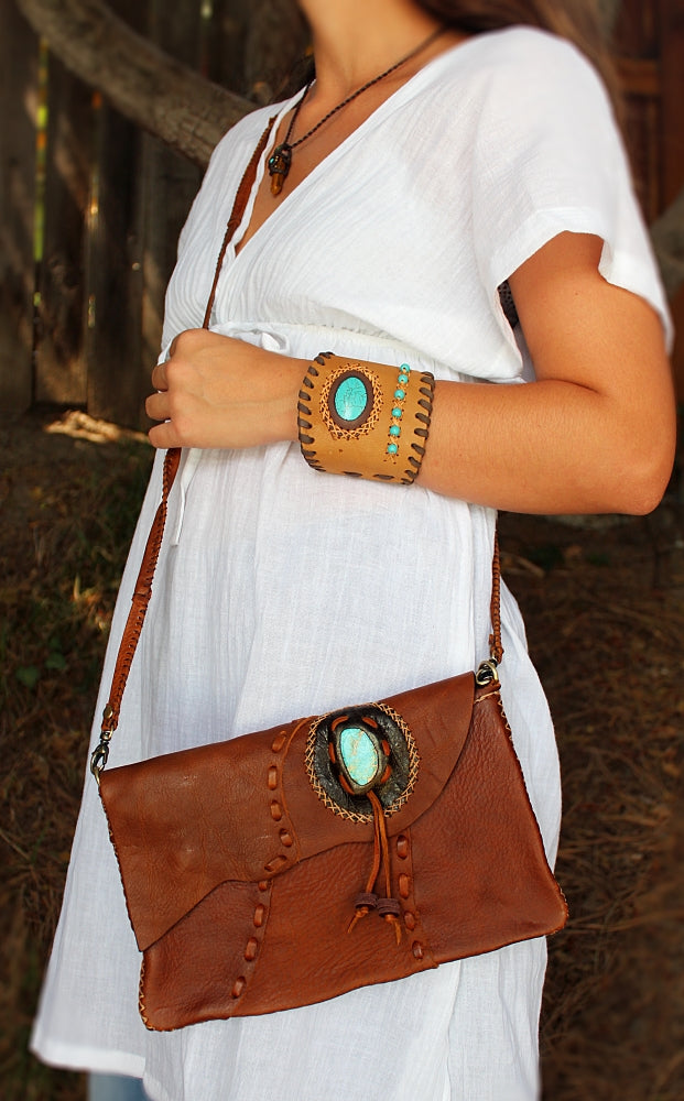 Handmade Cowhide leather adjustable clutch/purse with stone accent