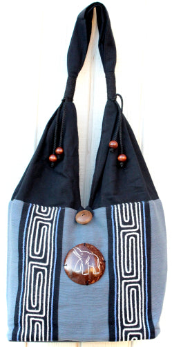 Handmade Cotton shoulder bag with hand embroidered design and hand-craved coconut shell accent